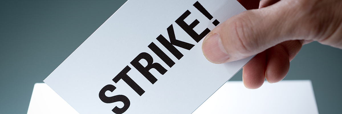 Strike vote card ballot man white hand BANNER