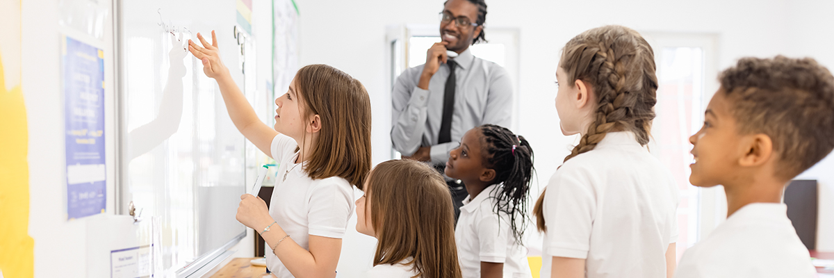 Behaviour management classroom mixed pupils black teacher BANNER