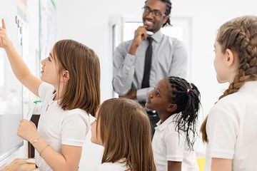 Behaviour management classroom mixed pupils black teacher BANNER