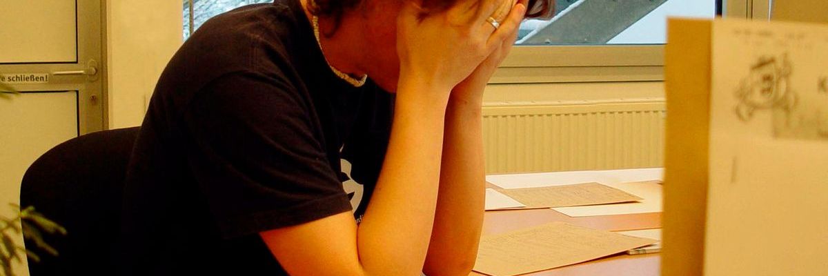 Woman stress white head in hands