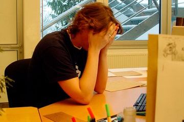 Woman stress white head in hands