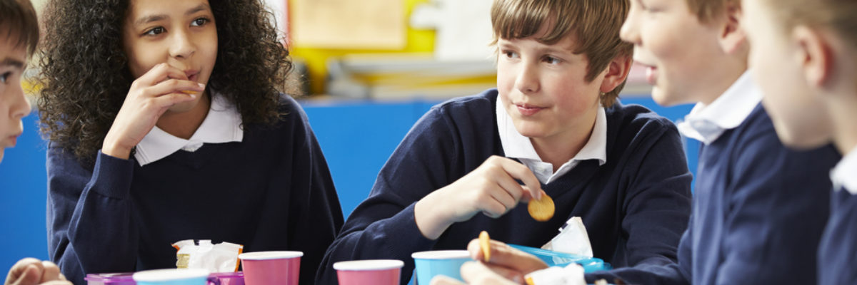 Mixed secondary pupils at lunch table