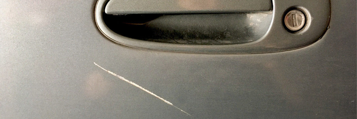 Car door lock scratch malicious damage