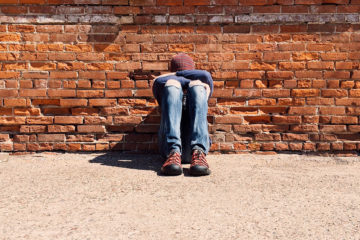 Pupil student secondary boy stress sitting outdoors