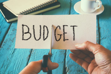 Budget funding cuts scissors