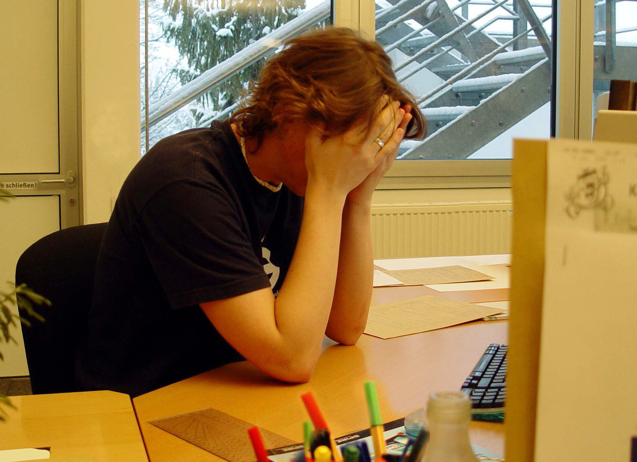 Woman stress white head in hands
