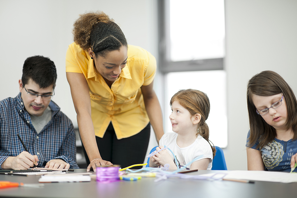 Black female teacher special needs pupils